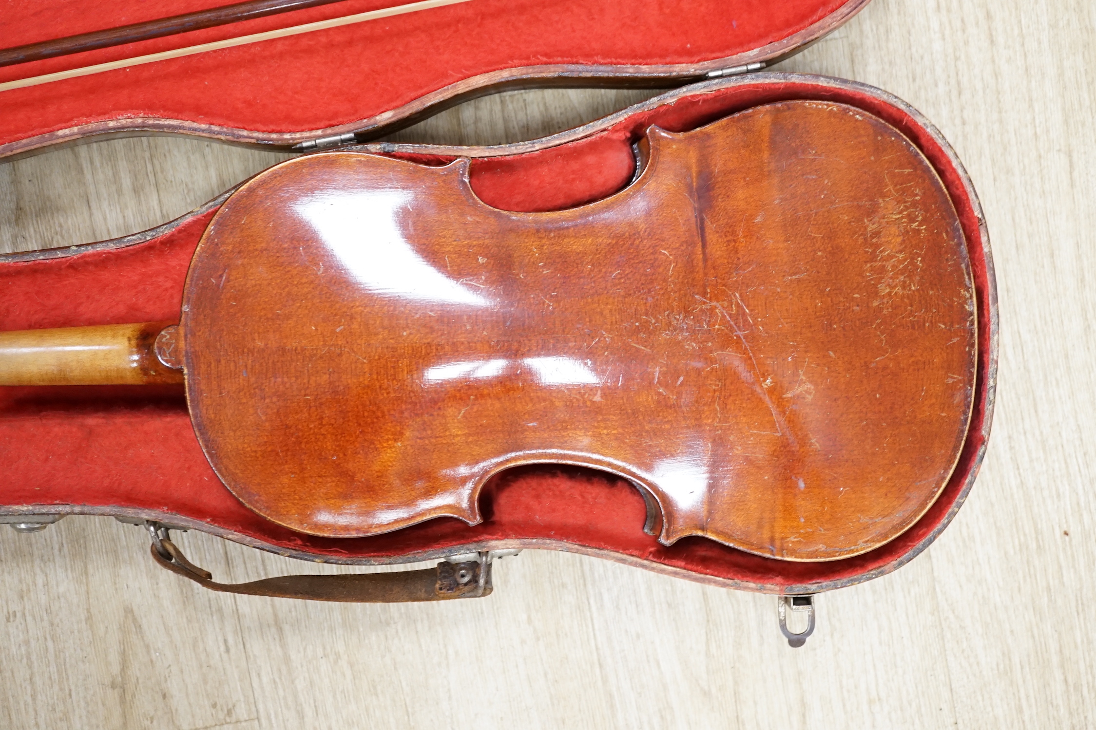 A cased early 20th century French violin and bow, label inside for Jerome Thibouville-Lamy, body length 36cm CITES Submission reference 5URFZXWK